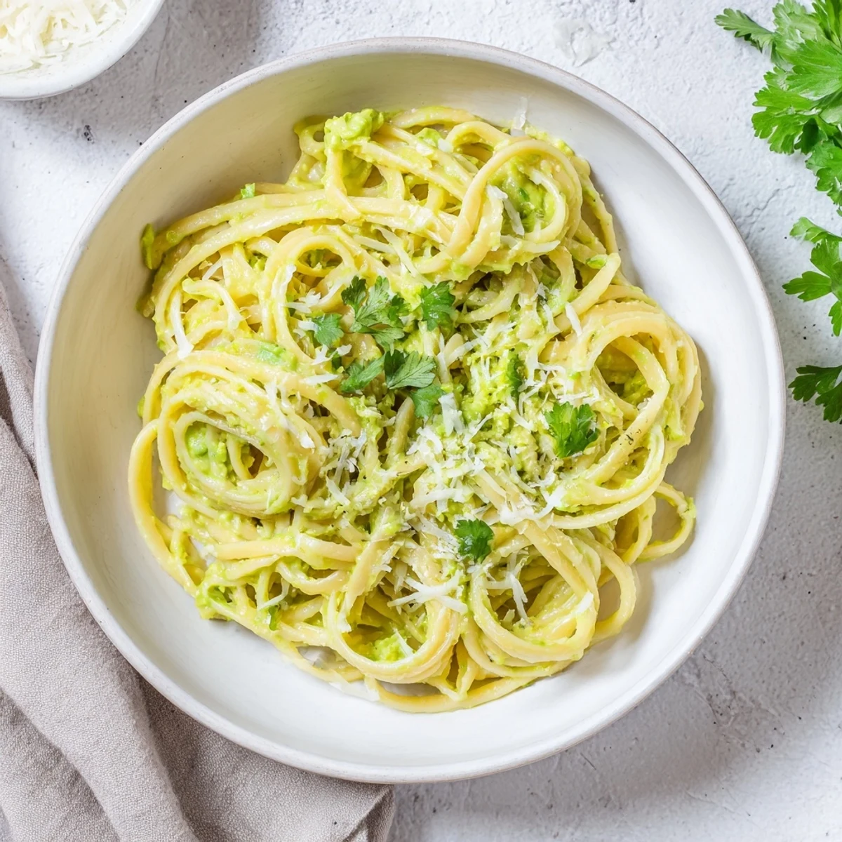 Enjoy a steaming plate of creamy avocado lime pasta, perfect for a quick, homemade dinner.