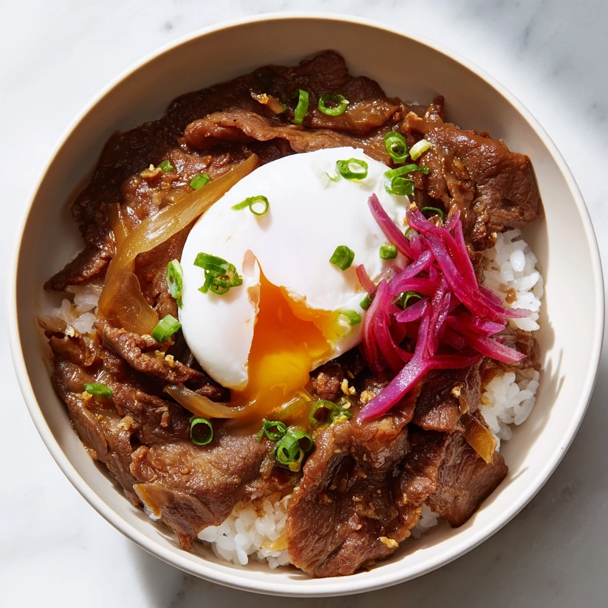 Savory Japanese-style Beef Bowl with Rice served in a deep ceramic bowl, ready to enjoy for an easy weeknight dinner.