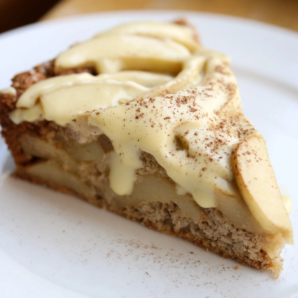 Golden-brown Irish Apple Cake with Custard Sauce, served beside a pitcher of rich, homemade custard for teatime.