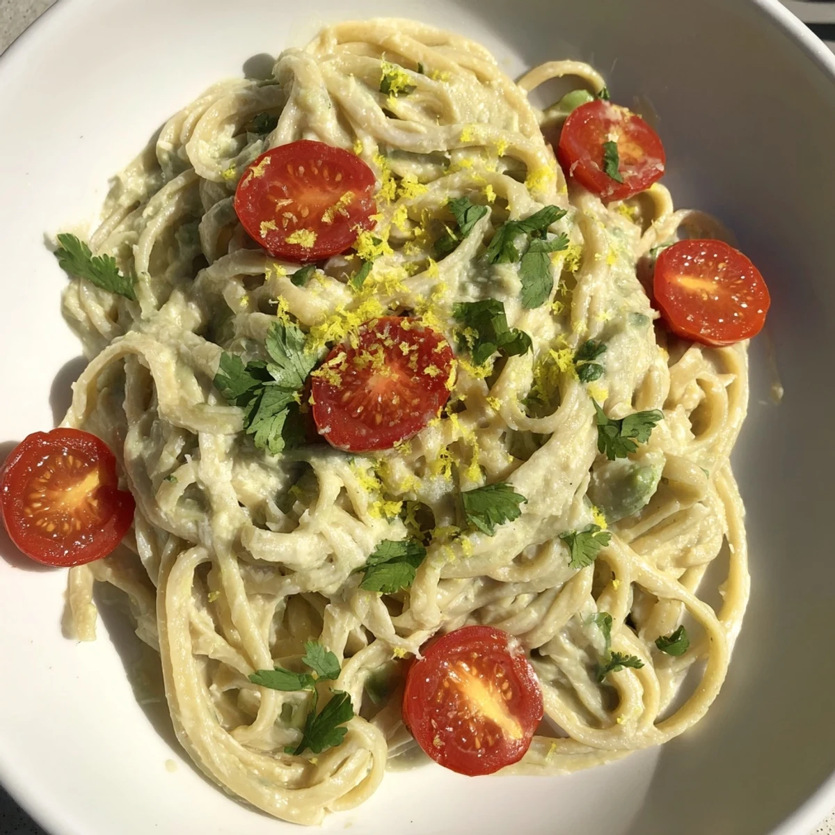 Served in a white bowl, this fresh vegetarian pasta dish offers a vibrant, colorful meal for weeknight dinners.