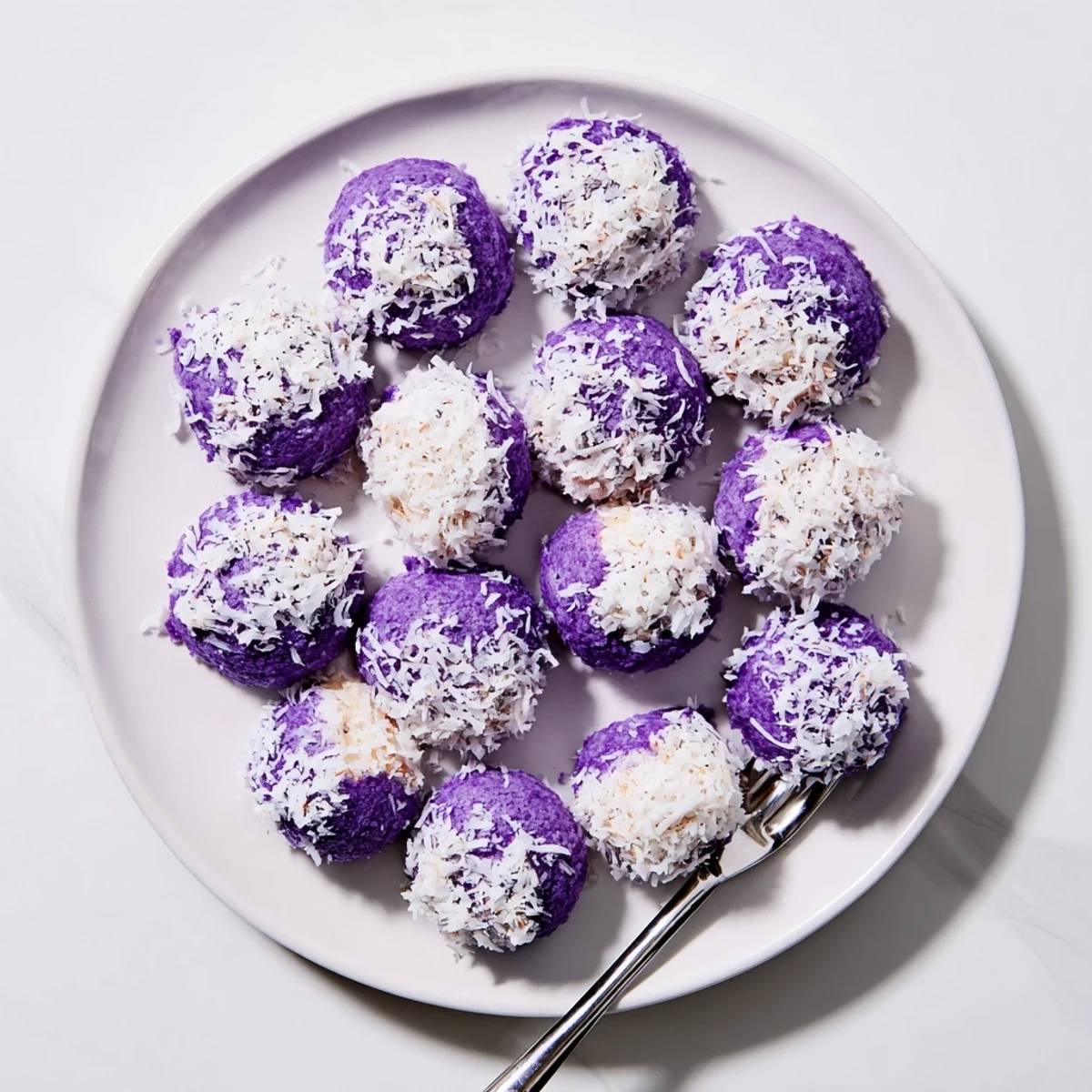 Batch of tender Coconut Ube Besito Cookies baked until set with lightly golden bottoms