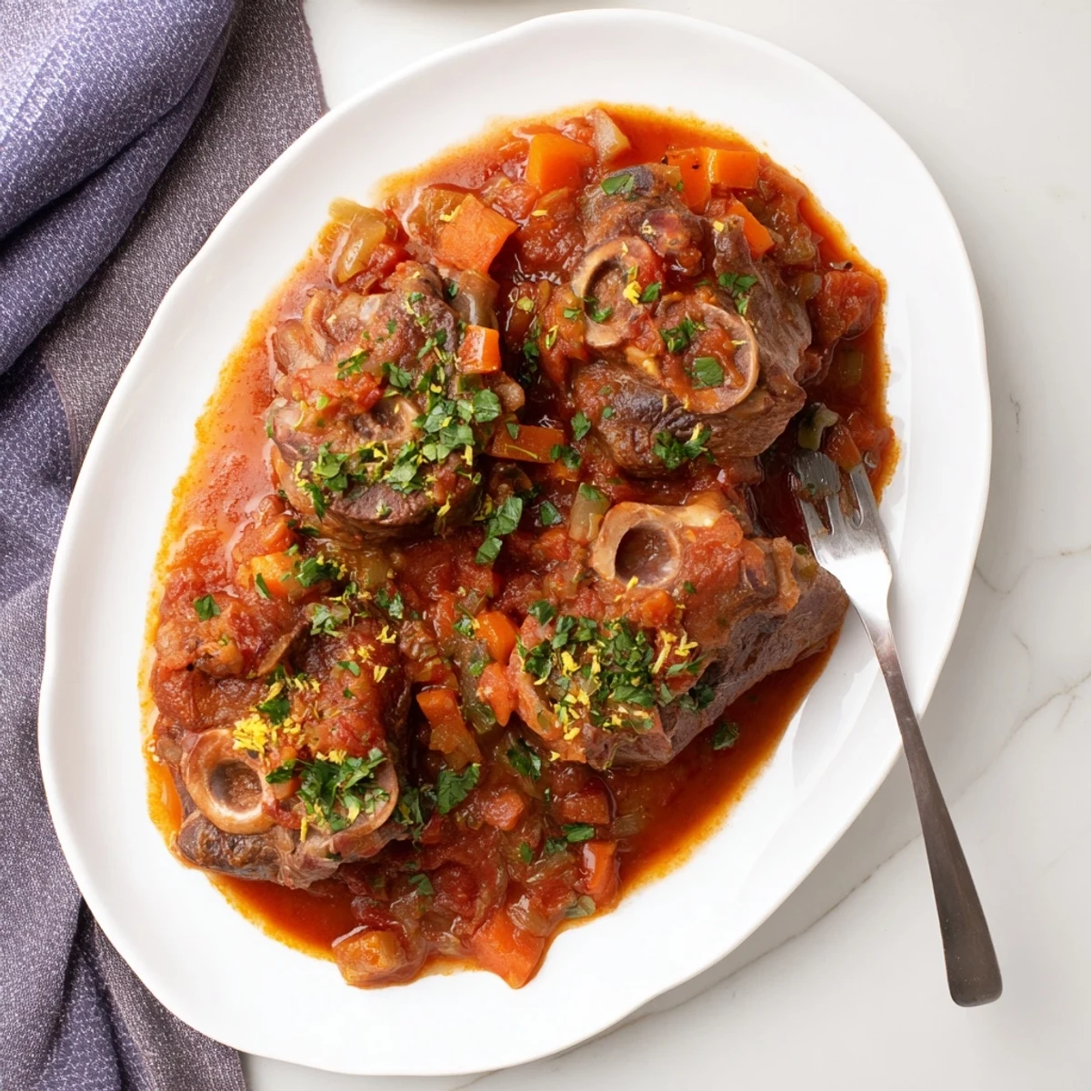 Italian braised veal osso buco served over creamy risotto with fresh parsley sprinkled on top