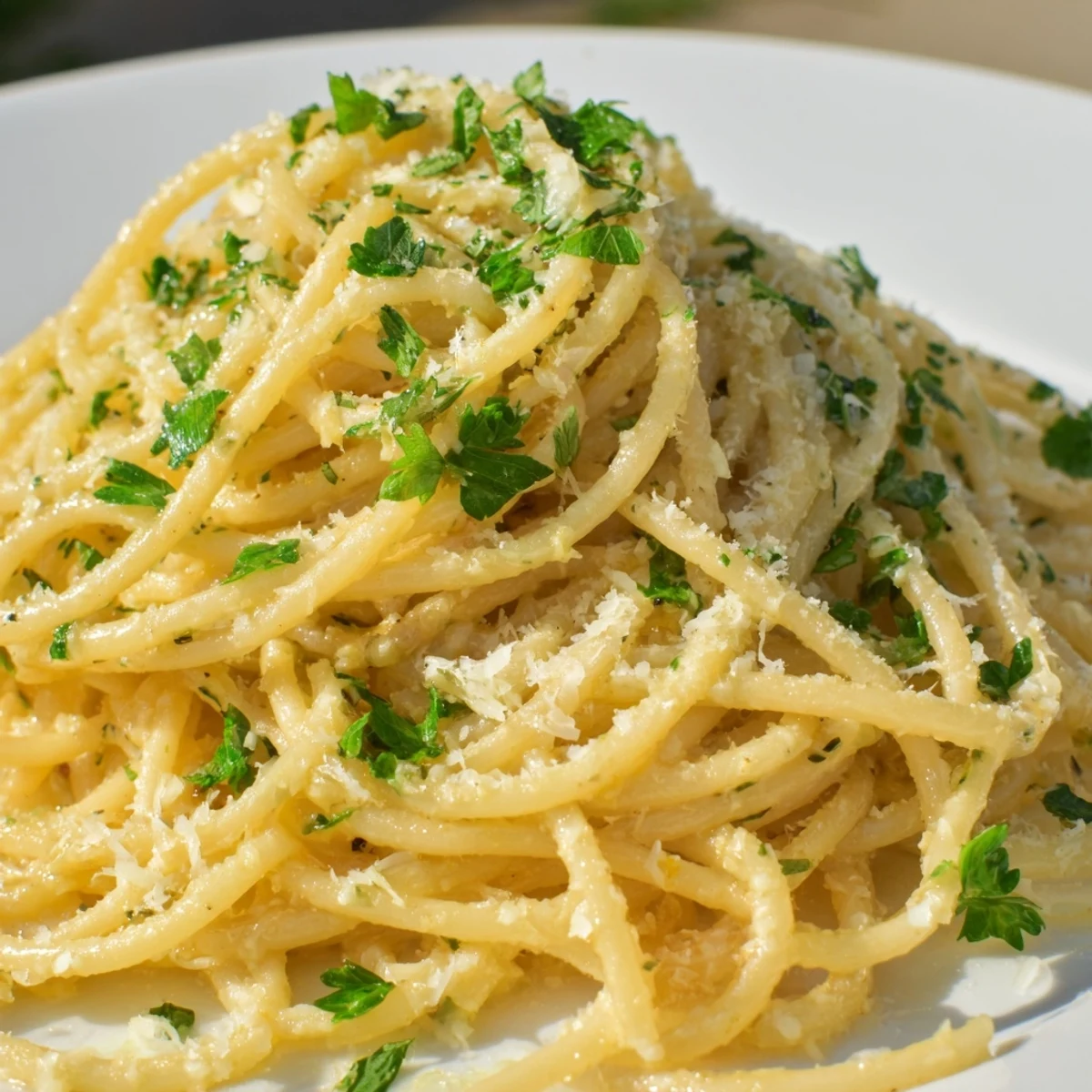 Golden strands of one pot garlic butter pasta tossed in aromatic buttery sauce with lemon zest