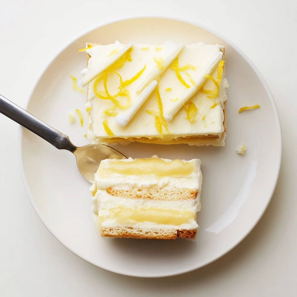 Creamy lemon tiramisu layered with syrup-soaked ladyfingers and bright lemon zest