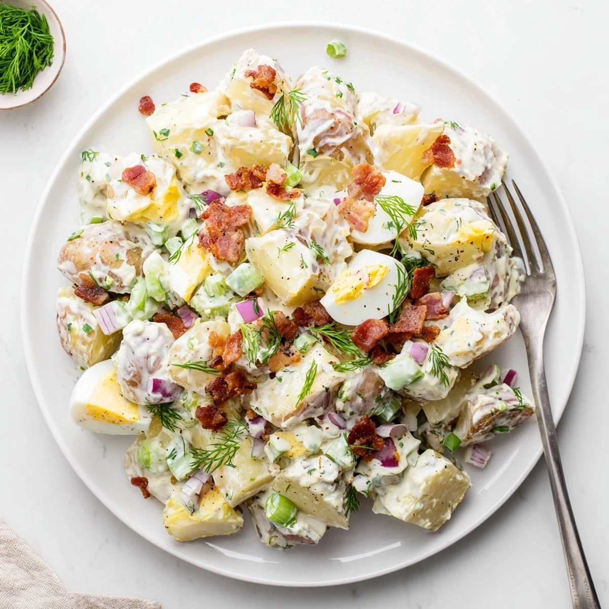 A chilled Steakhouse Potato Salad studded with pickles, scallions, smoky paprika.