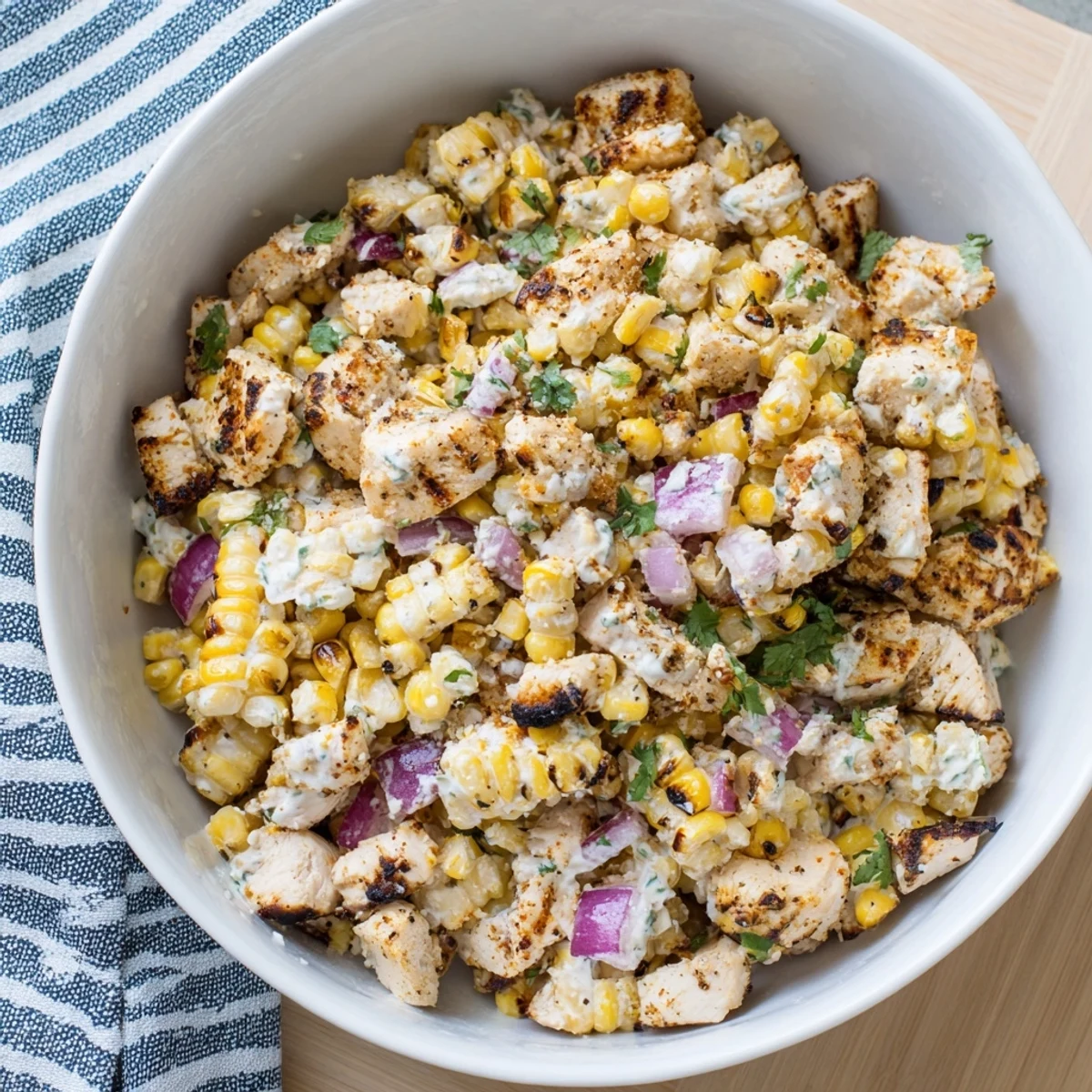 Protein-packed Mexican street corn salad with juicy grilled chicken and spicy lime yogurt dressing